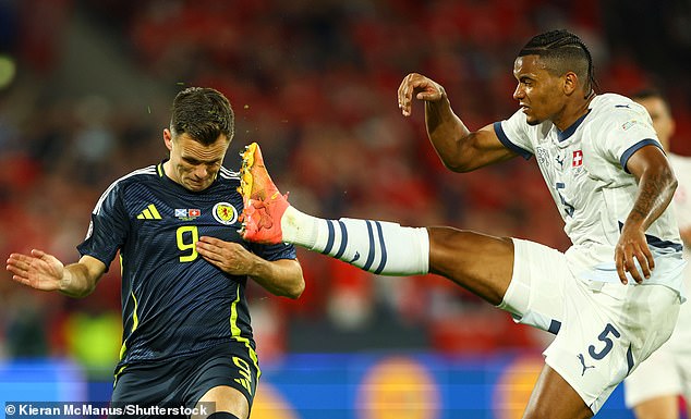 Akanji gets the ball before substitute Shankland in a nerve-wracking final for the Swiss