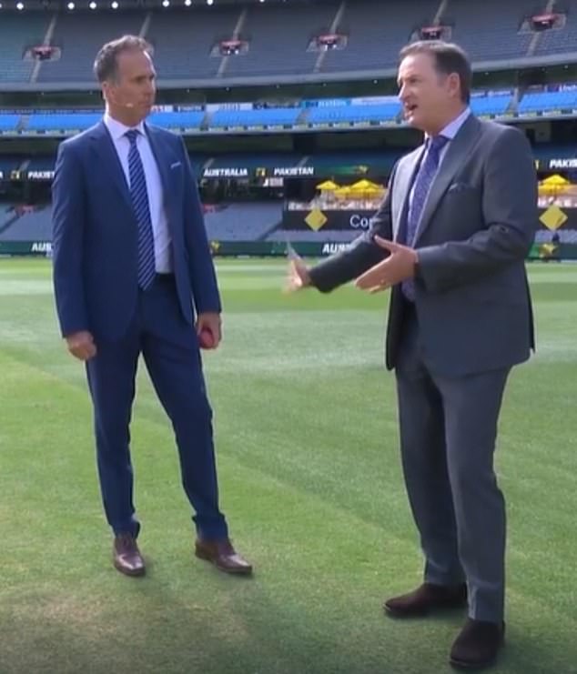 The 49-year-old is pictured left with fellow commentator and Australian cricketer Mark Waugh during last year's Boxing Day Test.  Vaughan's condition prevented him from picking up a microphone during the match and as a result he was sent to hospital