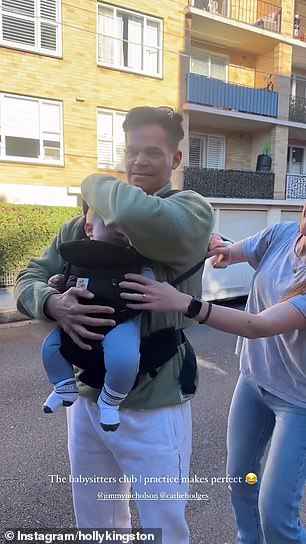 He also posted a funny video of his girlfriend Carlie Hodges helping him get strapped into the baby carrier
