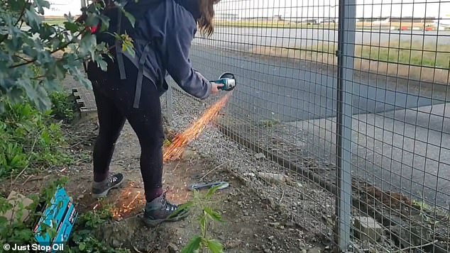 Video from the scene shows the two activists brutally cutting a fence on the edge of the airport