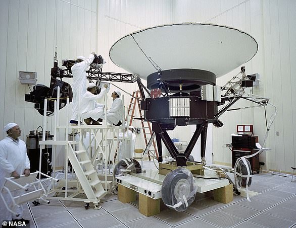 This file photo shows engineers working on the Voyager 2 spacecraft on March 23, 1977.  Voyager 2 is the only spacecraft to fly past all four outer planets: Jupiter, Saturn, Uranus and Neptune