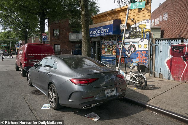 The suspect managed to crawl to safety under this silver Mercedes, which probably saved his life