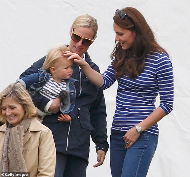 Kate, Zara and her daughter Mia share a warm moment in 2015 as they attend the Gigaset Charity Polo Match at the Beaufort Polo Club