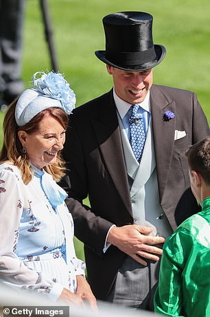 Carole Middleton speaks to Prince William, Prince of Wales, as they attend day two of Royal Ascot