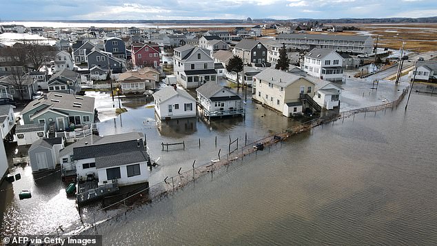 Natural disaster statistics have shown that severe storms and tornadoes are becoming more frequent and intense as a result of climate change.  Pictured: Coastal flooding in Hampton, New Hampshire in January