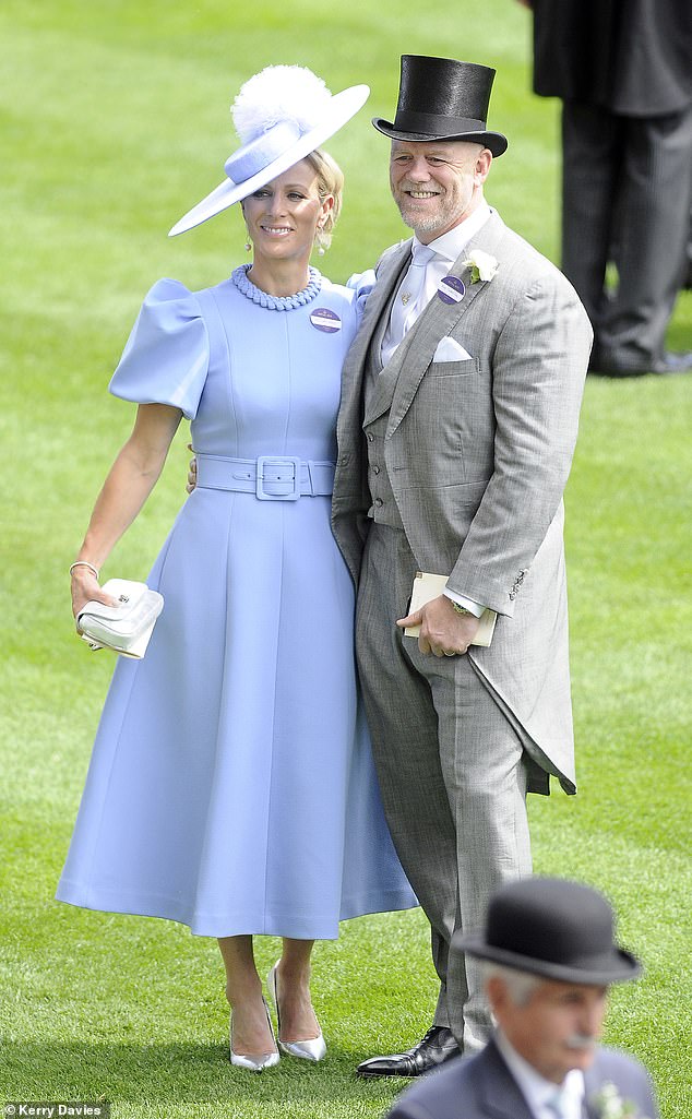 Zara stole the show on Ladies' Day in a dazzling blue dress, alongside her rugby-playing husband Mike Tindall, who looked smart in a gray suit and top hat