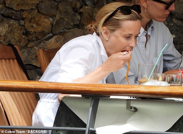 Later in the day, Reese was seen enjoying an outdoor lunch, which included a delicious plate of spaghetti