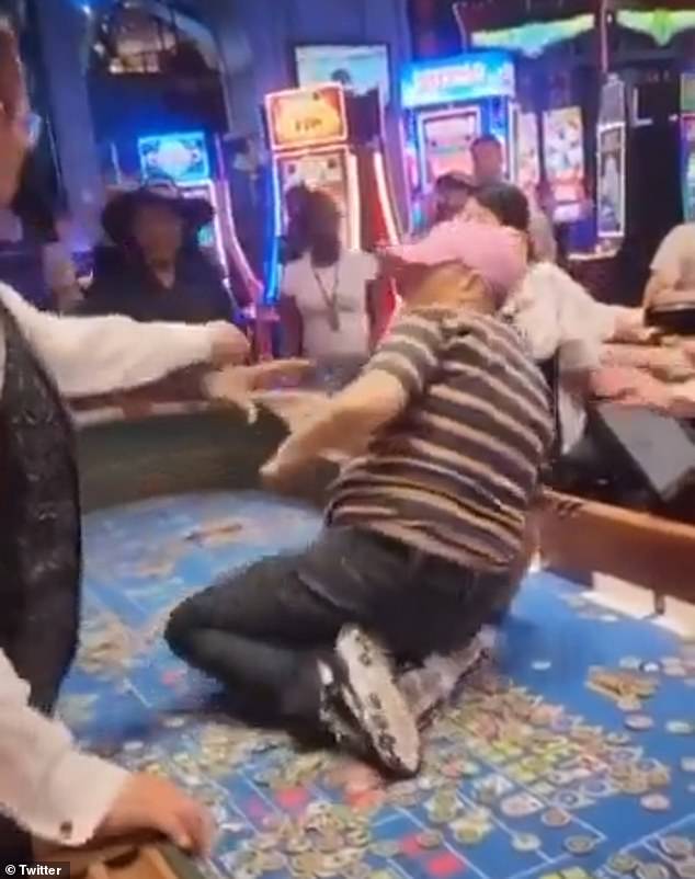 At one point, a casino employee tried to grab her and she punched him away