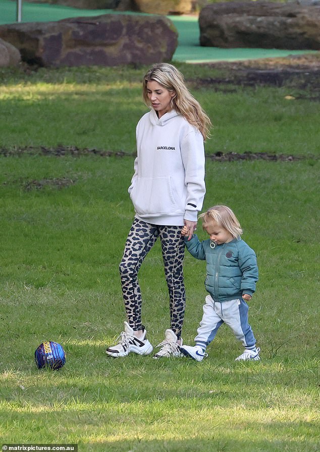 She also wore skin-tight leopard print leggings and white sneakers.  The mother-of-one wore her blonde hair down and went for a natural make-up look