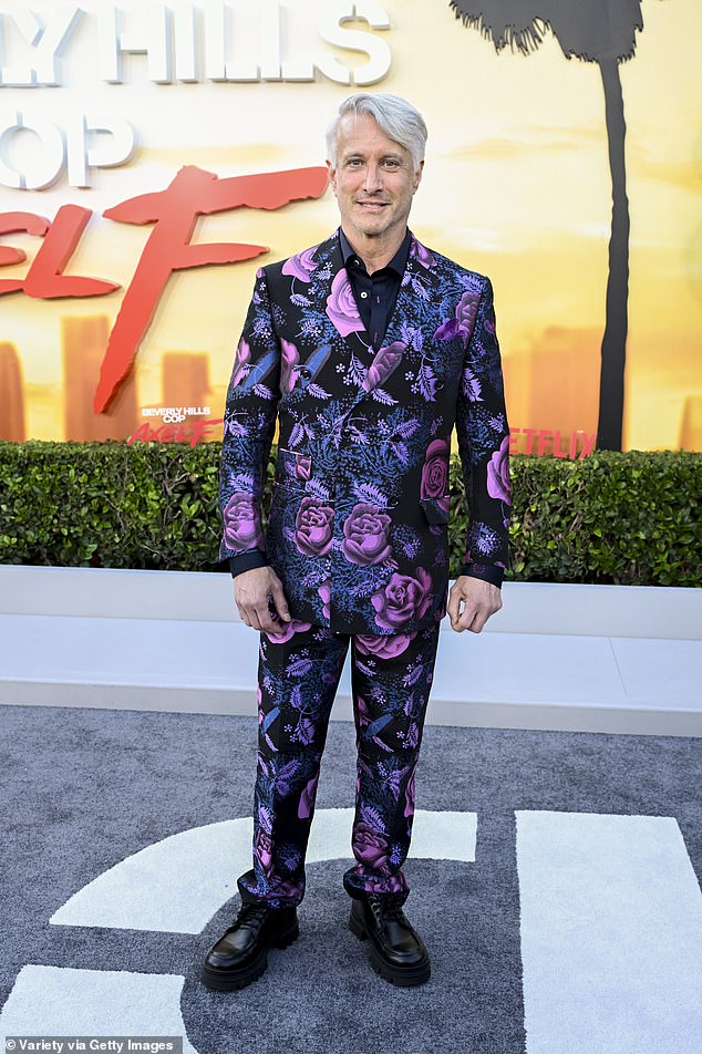 Always one of a kind, Bronson Pinchot, 65, stood out in a purple and black floral suit with matching shoes and his hair dyed platinum blonde with a part on the right
