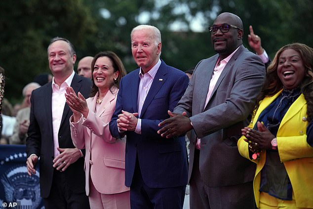Pictured: Joe Biden, Dough Ehmoff, Kamala Harris, Philonise Floyd, Keeta Floyd.  Biden raises concerns as he appears to freeze during Juneteenth celebration concert at the White House next to a dancing Kamala Harris - before Floyd - the brother of the late George Floyd - puts his arm around him
