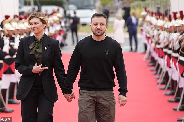 Olena Zelenska and Volodymyr Zelensky, pictured on Omaha Beach in France on June 6 this year, first met when they were at school together before getting married in 2003