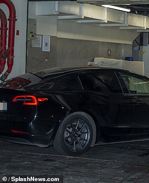 Kanye got out and rushed back to the hotel in a Tesla