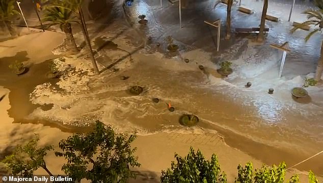 A 'meteo-tsunami' causes water to flow over the sea wall into a city on Mallorca