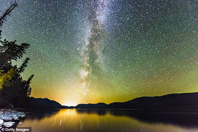 Above, the Northern Lights and the stars of the Milky Way visible above Lake McDonald, the largest lake in Montana's Glacier National Park - very far north of this UAP sighting