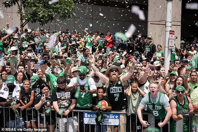 Celtics fans lined the streets Friday as the parade wound through downtown Boston