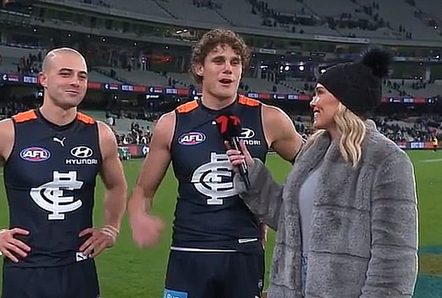 Holmes also interviewed Carlton stars Charlie Curnow and Alex Cincotta and also shared a kiss on the cheek and hugs with them