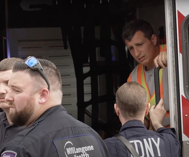 The driver of the truck that struck Conigliaro was comforted in an FDNY ambulance
