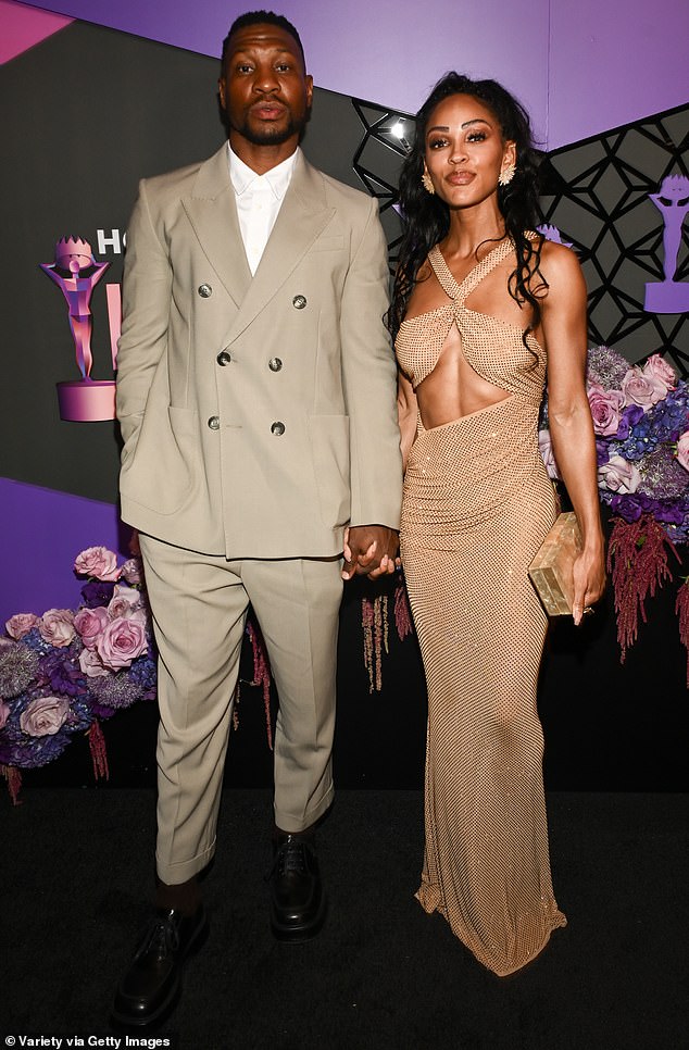 Jonathan Majors wore a beige double-breasted suit as he walked the red carpet with Meagan Good