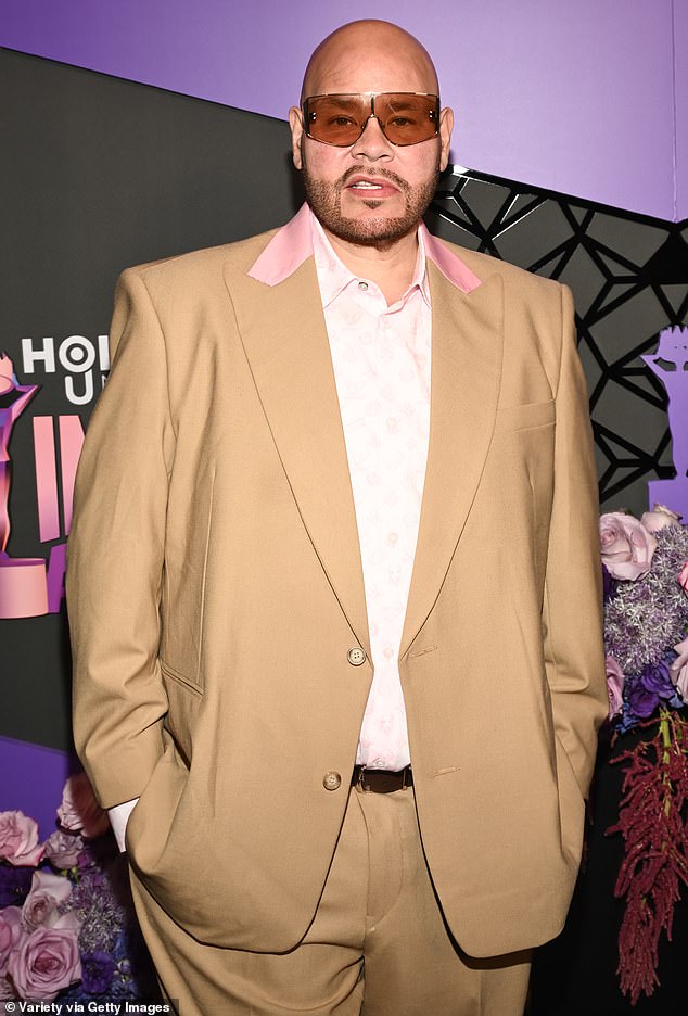 Fat Joe wore a tan suit with pink lapels and a white plaid shirt