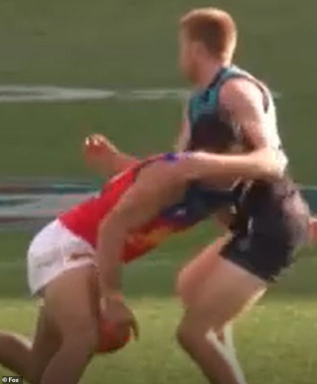 Lions star Cameron Rayner (left) lost control of the ball and while trying to win back the Sherrin, he headbutted the home side's Willem Drem (right) but was awarded the free kick.