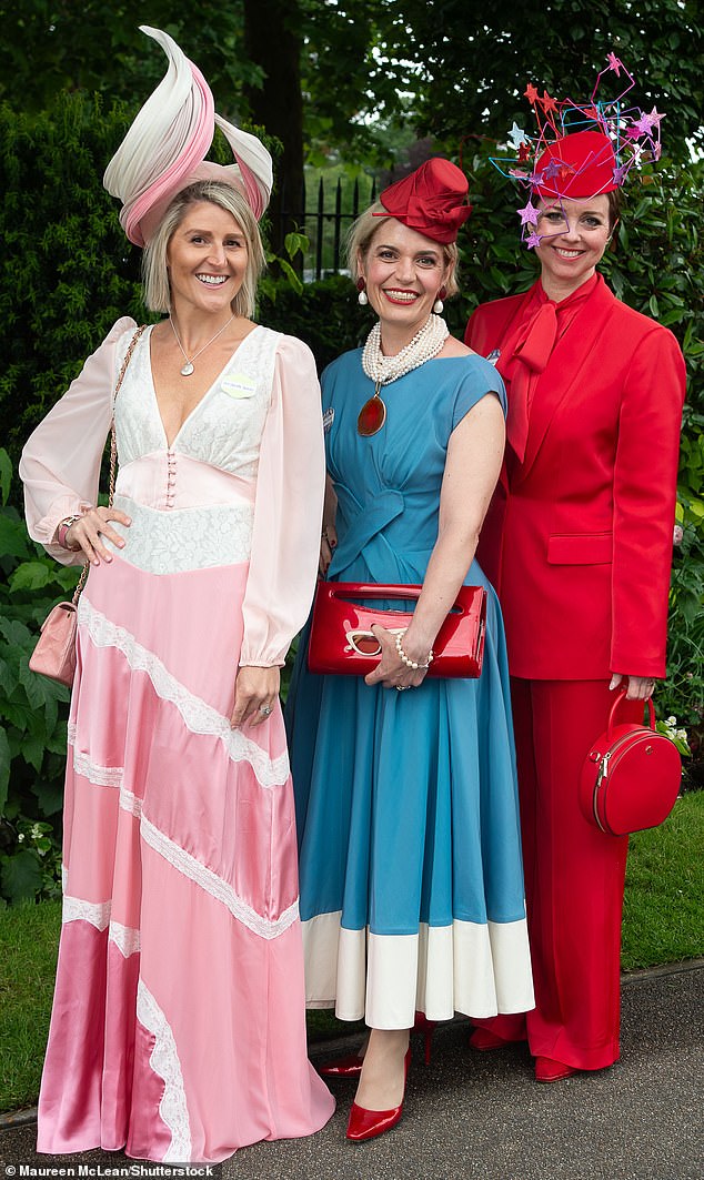 This trio were all smiles as they posed for photos in their brightly colored ensembles, opting for pink, blue and red pieces