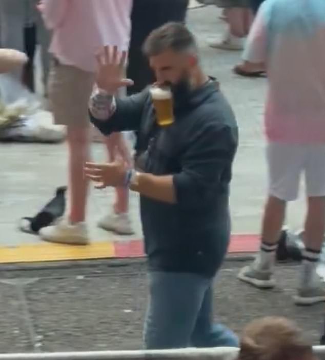 Kelce was also spotted walking around Wembley Stadium with a beer hanging from his mouth