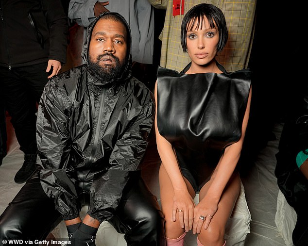 The Australian beauty, 29, who has been criticized again for her 'scandalous' outfit, appears to have made a strategic move with her striking hairstyle (pictured with Kanye West at MFW in February)