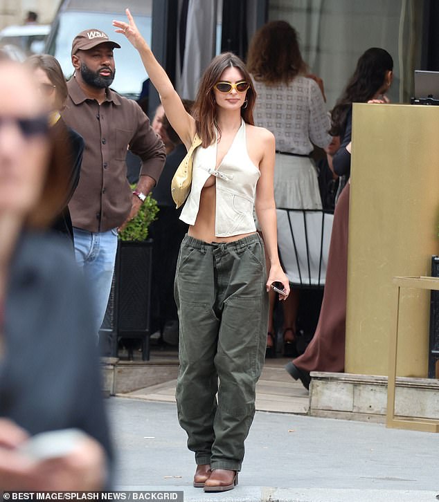 The star wore a similar sleeveless top on Thursday as she enjoyed lunch at L Avenue in Paris