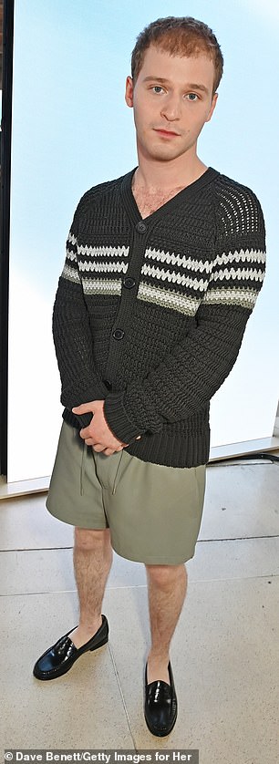 Actor Fred Hechinger opted for shorts and a crocheted black and white cardigan