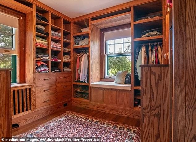 Pictured: A walk-in closet in the luxurious Adirondack home