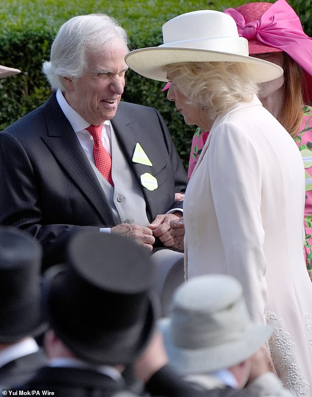 The American actor and director (pictured, left) seemed delighted when he met Queen Camilla today (pictured, right)