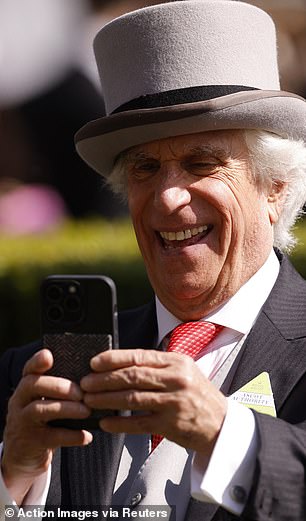 Henry Winkler takes a photo during Royal Ascot on Saturday