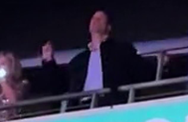 Prince William is pictured showing off his 'dad dance' moves as he attends Taylor Swift's concert at Wembley