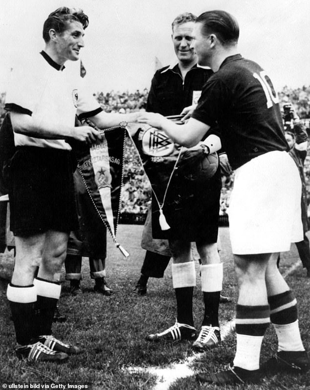 Ferenc Puskas (right) exchanging pennants with Fritz Walter before the 1954 World Cup final