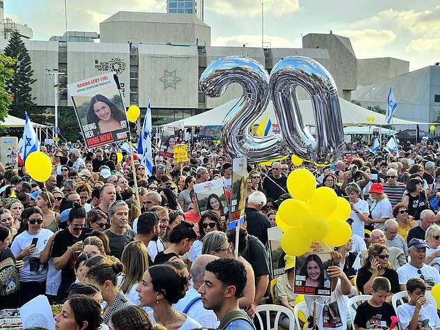 On Saturday evening, Dr. Levy Shachar led thousands of people through the streets of Tel Aviv carrying giant posters of her daughter and holding balloons to mark her birthday.