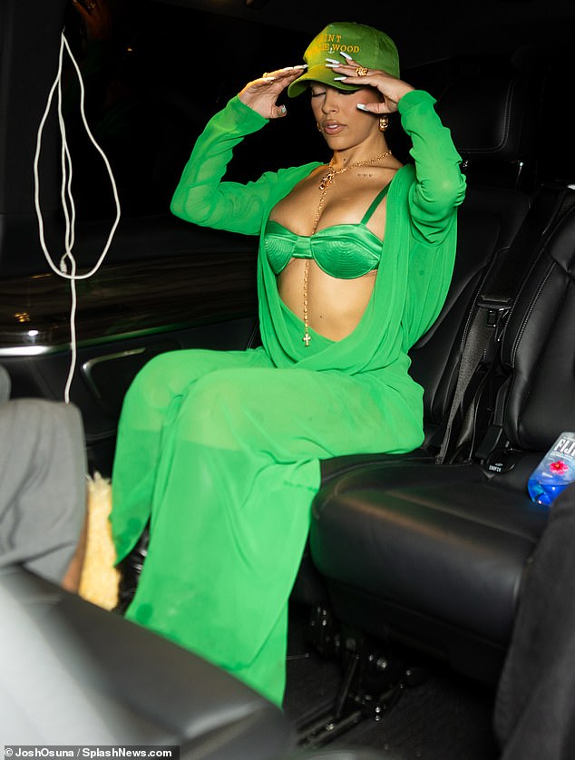 The Los Angeles resident was pictured gathering herself in the backseat of her chauffeured vehicle before getting out to mingle with the waiting crowd outside the nightclub.