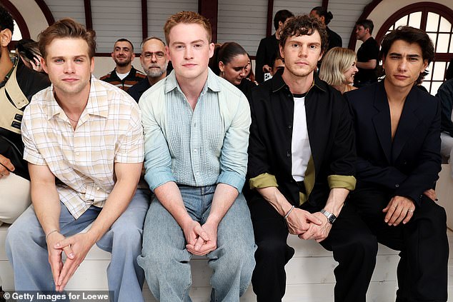 (L-R) Leo Woodall, Kit, Evan Peters and Enzo Vogrincic sat together to watch the catwalk