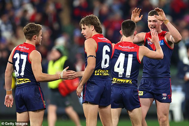 Melbourne have lifted themselves back into the AFL's top eight by battling their way to a heartbreaking three-point win over North Melbourne