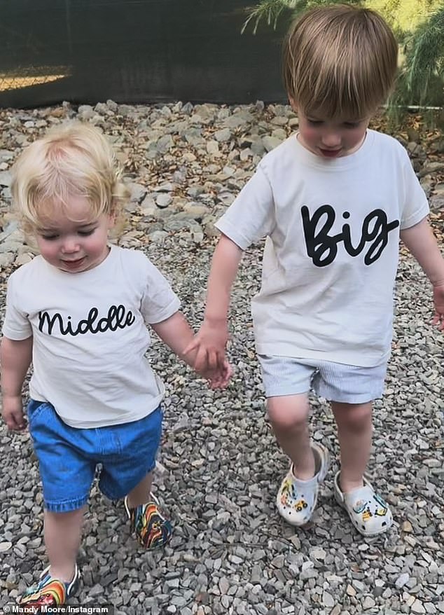 She announced the news on Friday by posting a heartwarming photo of her sons Gus, two, and Ozzie, one, wearing T-shirts that read 