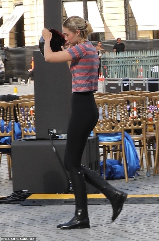 Gigi Hadid, 29, also wore black leggings and riding boots for the rehearsal, paired with a red and gray striped crop top