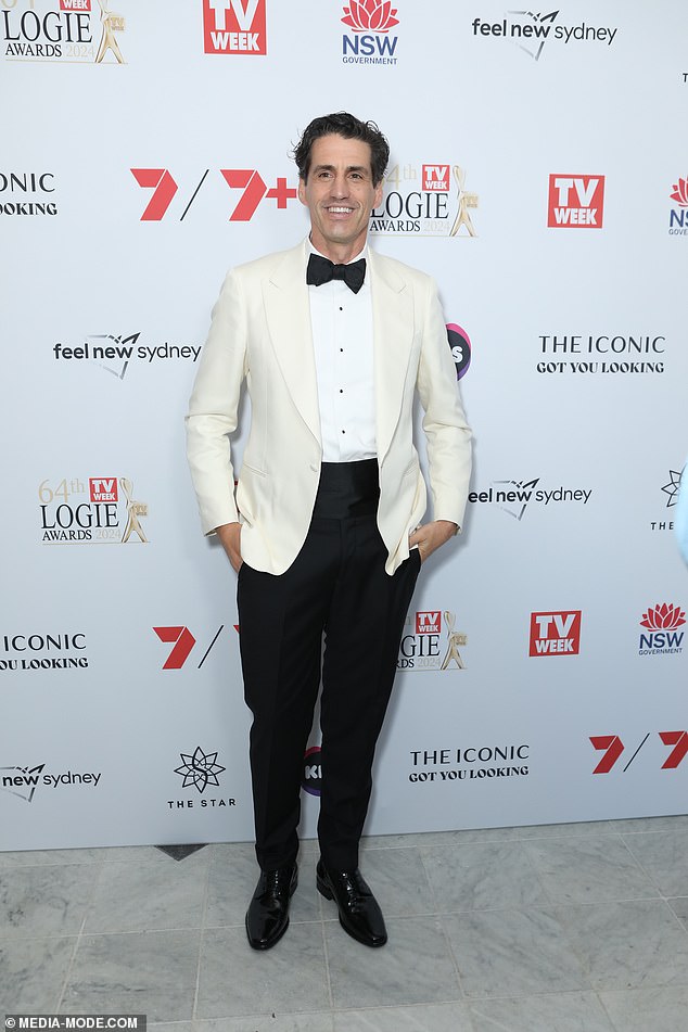 Comedian and TV presenter Andy Lee looked stylish in a white blazer which he teamed with a black bow tie, trousers and shiny shoes