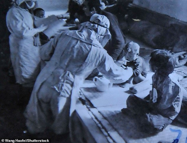 Manchukuo puppet state staff conducting bacteriological tests on infants and small children - under the direction of Japanese Unit 73 and Japanese Army Unit 731 - in November 1940