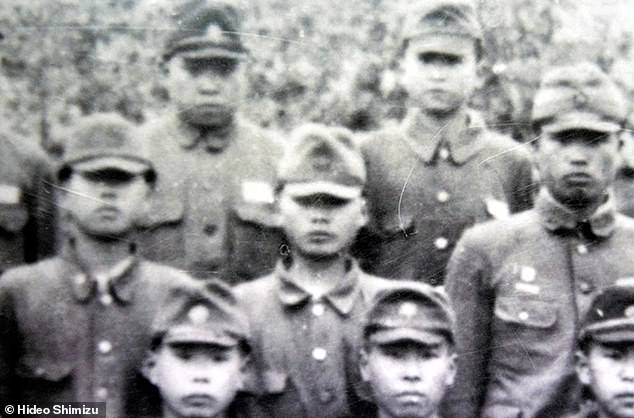 Hideo Shimizu, center, in 1945, when he was a teenage cadet newly recruited to Unit 731