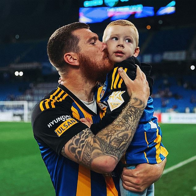 Adam brought Konor onto the field after games in Korea