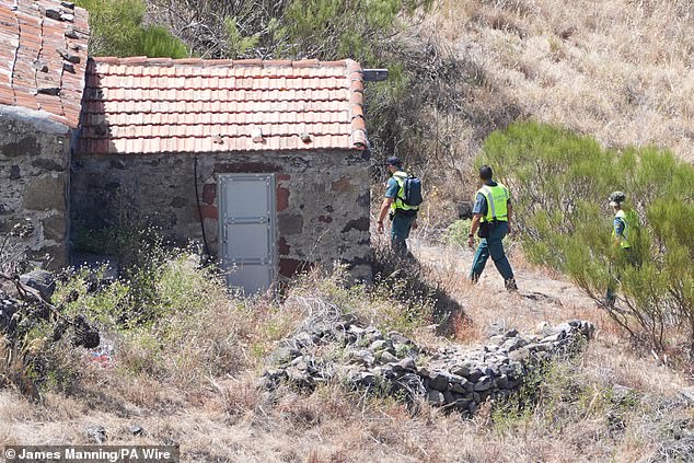 Search teams looked at buildings in a ravine near the village of Masca on Sunday morning