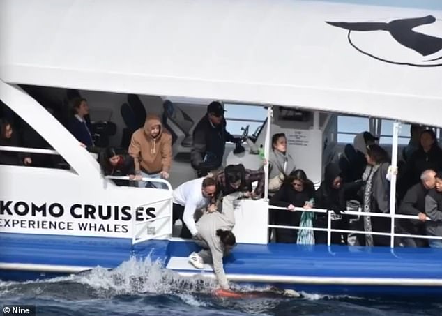 Shocked whale watchers helped the woman back into the ship