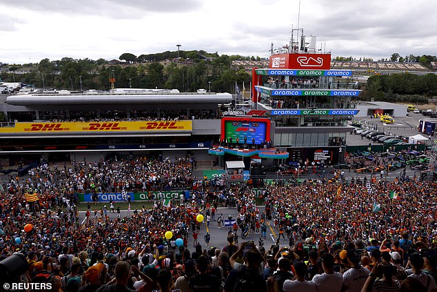 Fans gathered on the track to watch the podium ceremony after Verstappen's stunning victory