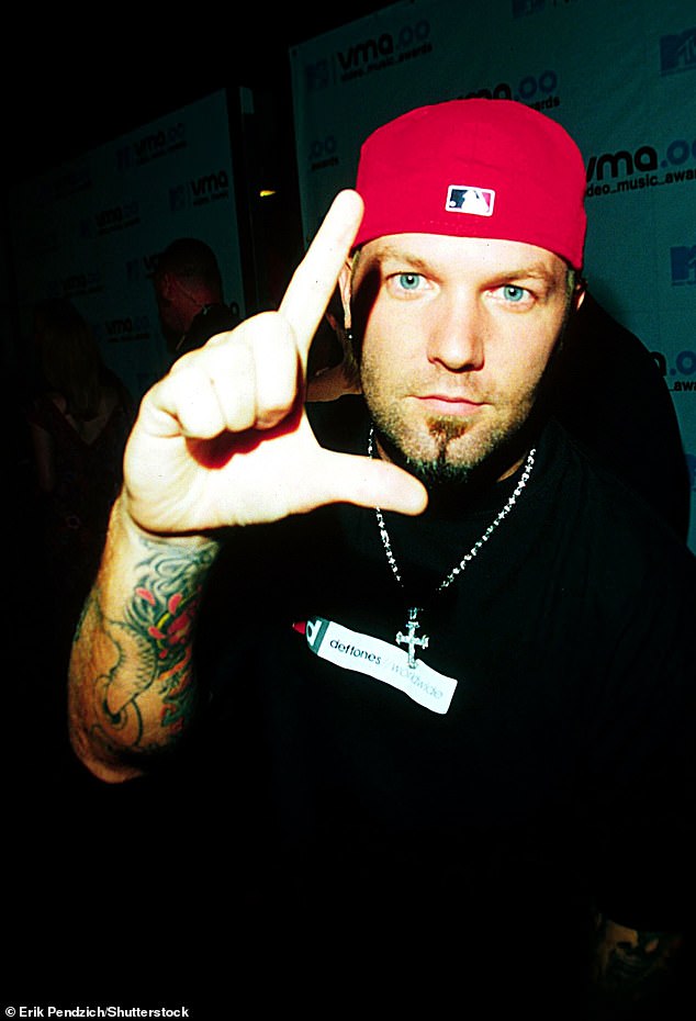 It's Fred Durst - the Limp Bizkit frontman who sported a distinctive goatee and rearguard when he first rose to fame (pictured here in 2000)