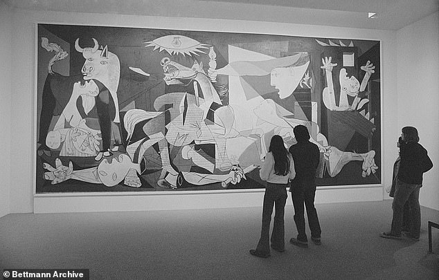 Spectators view Guernica, executed in 1937 by Spanish-born painter Pablo Picasso at the Museum of Modern Art in New York City